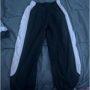 Windbreaker pants black and white as well as cream